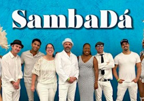 A group of people dressed in white posing under the text 