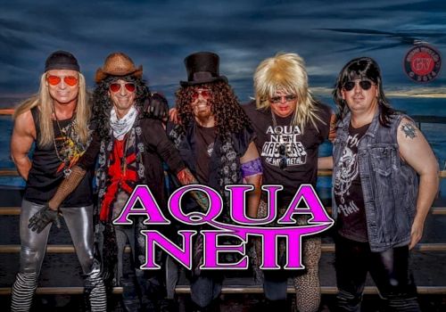 The image shows five people dressed in glam rock style with the text "Aqua Netl" in bold letters overlaid on the image.