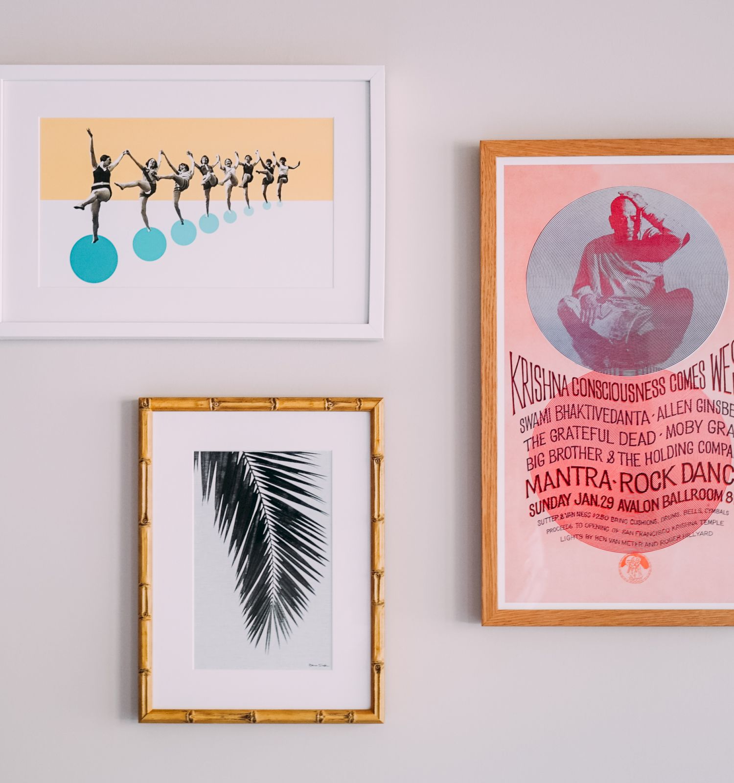 Three framed artworks: dancers on blue spheres, palm leaf with bamboo frame, and a vintage concert poster in pink and orange.